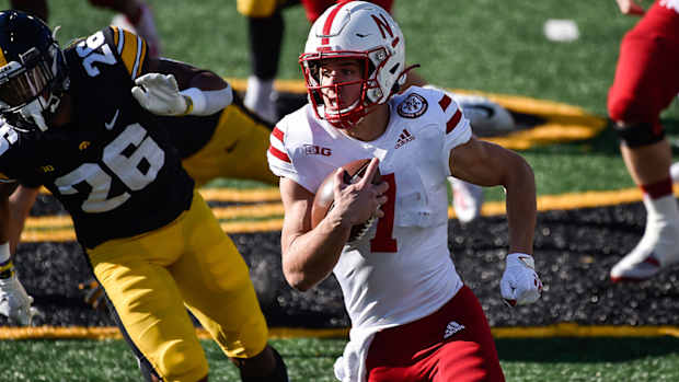 Luke McCaffrey running with the ball